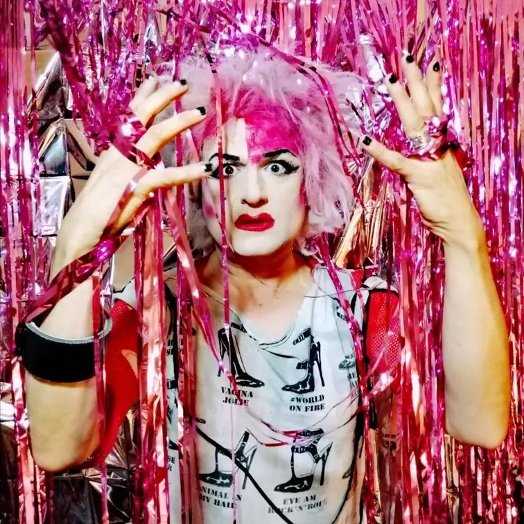 Anita posing pink party streamers